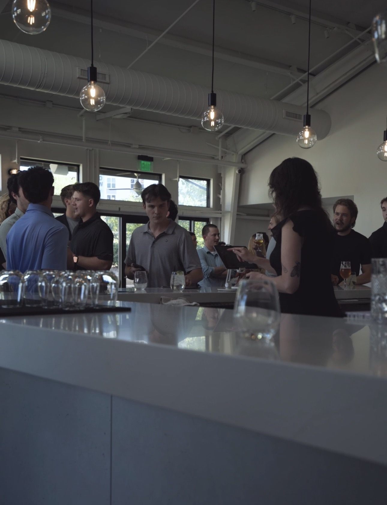 RAL Meetup members networking at the bar between sessions